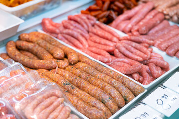 Catalan sausage Butifarra with minced pork on a tray close up