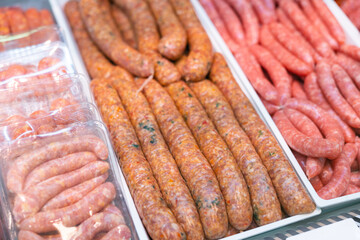 Sausages bufifarra made of pork and chicken minced meat ready for grilling in meat shop