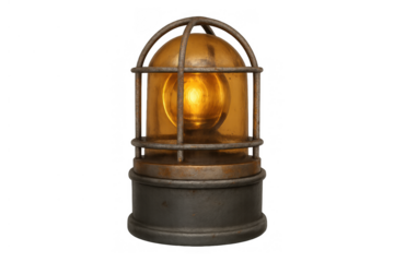 Vintage industrial warning lamp with amber light bulb in a metal cage offering a rustic and old safety beacon