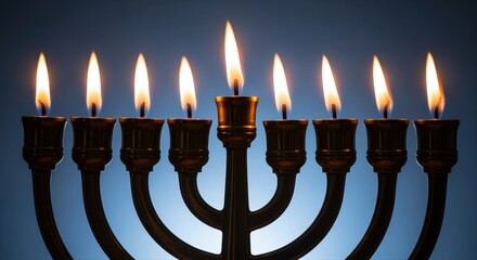 traditional menorah with lit candles against a blue background celebrating hanukkah