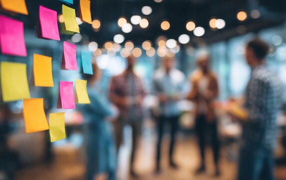 Team Strategy Session Blur - Blurred background of a brainstorming session among team members. High quality. High quality