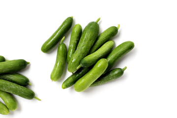 Fresh mini baby cucumbers on white background