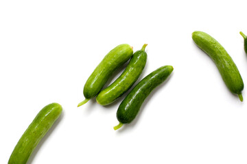 Fresh mini baby cucumbers on white background