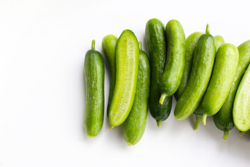 Fresh mini baby cucumbers on white background