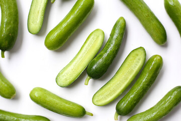 Fresh mini baby cucumbers on white background