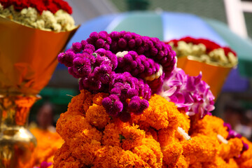 Flower garlands offered for worship at the Erawan Shrine in Bangkok, Thailand.