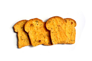 Crispy garlic bread slices on white background.