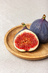 Fresh cut figs on a light background.