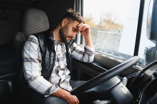 Tired truck driver experiencing stress and headache