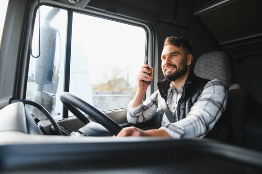 Truck driver communicating using cb radio, smiling