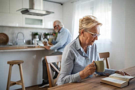 Senior couple relaxing enjoying leisure time at home