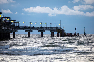 Pier in the Baltic Sea in Poland. View from the beach.