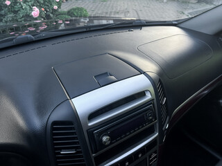 Clean dashboard of a modern car featuring stylish design and high-quality materials in a serene...