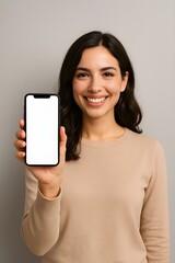 Naklejka premium woman holding a smartphone with blank screen