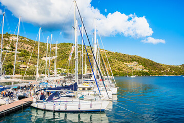 SIVOTA PORT, LEFKADA ISLAND - SEP 25, 2025: Sailing boats anchoring in Sivota port, Lefkada island, Greece.