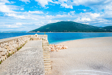 Old stone wall of Agia Mavra castle and beach view, Lefkada island, Greece