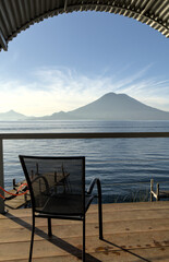wooden dock pier at lake atitlan in guatemala (volcanic caldera crater) deepest lake in central...