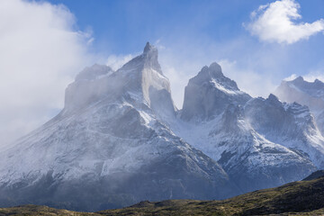 close up of a sunlit cuernos principal on a stormy autumn day