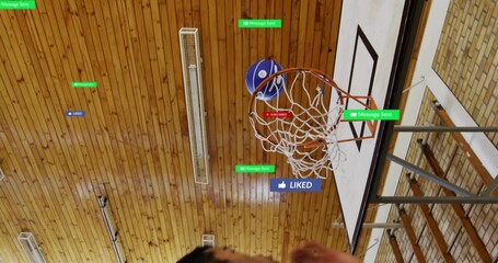 Passing blue basketball through white net in school gym, players in sportswear showing UI labels
