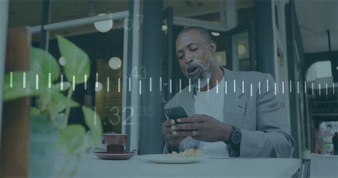 Holding man in gray blazer and tee checking smartphone at cafe, with cup plant, data overlay