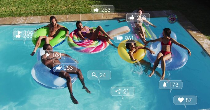 Floating six adults wearing swimwear, lounging on pool floats in backyard pool, social overlays - Powered by Adobe