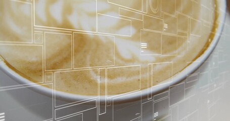 Displaying white ceramic cup sitting on pale table, with creamy latte foam swirl and UI overlay © vectorfusionart