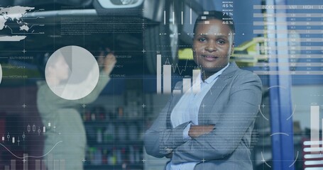 Standing woman in gray blazer crossing arms and watching camera at tech office with data overlays