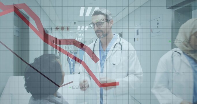 Talking doctor in white coat consulting seated patient in hospital hall with stethoscope, red chart