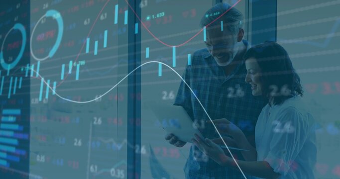 Holding tablet, pair in plaid-shirt and white-top studying charts on office window, copy space
