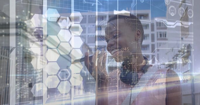 Reaching woman wearing sleeveless top, headphones using AR HUD on glass at tech lab, copy space