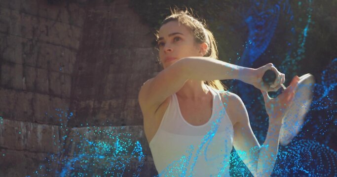 Swinging female tennis player in white tank top, extending racket at outdoor court with blue trails - Powered by Adobe