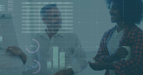 Presenting central man white shirt gesturing left while team analyzing charts at office flipchart