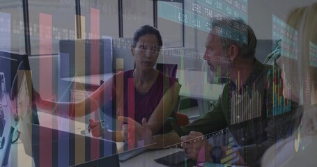 Pointing woman in sleeveless blouse and man discussing data on monitor and laptop in office