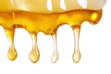 Close-up view of golden honey dripping from a white surface. its viscous texture and natural shine. ideal for culinary or health-related imagery