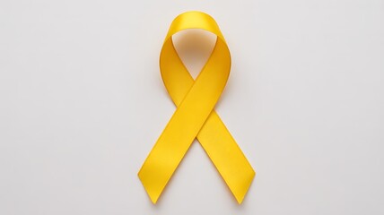 Yellow awareness ribbon on white background.