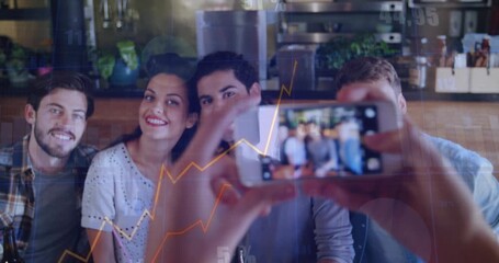 Trio leaning in to fit frame in cafe, hands raising phone, animated business charts occluding trio