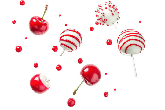 A display of red candy apples and chocolate-covered treats. artistically arranged against a white background. evoking a festive atmosphere perfect for celebrations and events