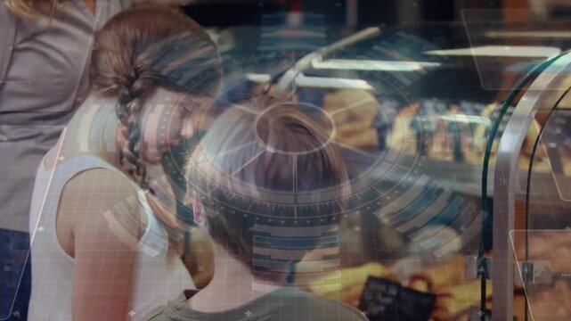 Boy pointing at bakery case children leaning choosing pastries as woman guiding HUD overlaying case