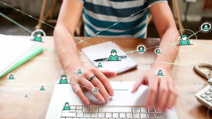 Man typing on laptop at desk, causing animated green avatar links growing tech network for work - Powered by Adobe