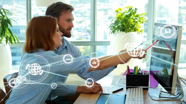 Man pointing pen triggers growing globe icons and lines while woman taking notes on business data