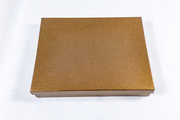 Plain metallic bronze and copper-toned gift box package present, brown square golden mockup material