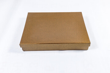 Plain metallic bronze and copper-toned gift box package present, brown square golden mockup material