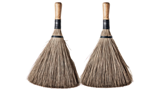 Two rustic brooms with wooden handles isolated on transparent background