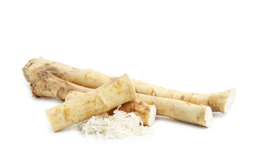 Grated horseradish and roots isolated on white