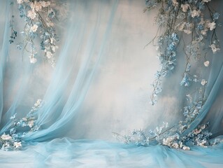 Elegant backdrop with flowing blue fabric and floral arrangement for weddings