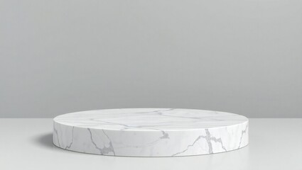 Minimalist white marble podium on a clean white surface with a grey background