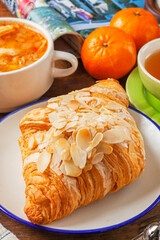 Almond butter croissant on white plate   