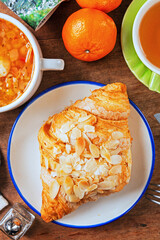 Almond butter croissant on white plate   