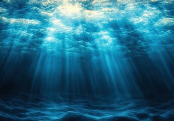 Sunlight streaming through a rippled ocean surface into deep blue waters, illuminating a textured seabed with serene, mysterious rays