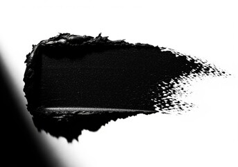 Thick, textured black cosmetic swatch creating a dramatic, high contrast abstract smear